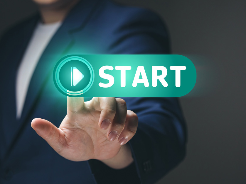 person pressing digital start button