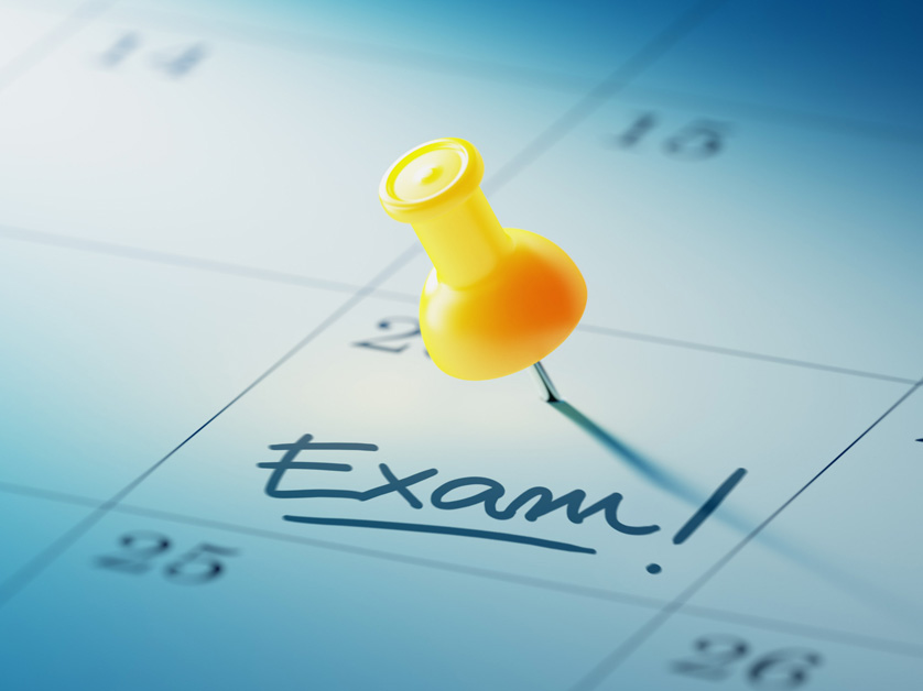 calendar with pushpin on date marked exam