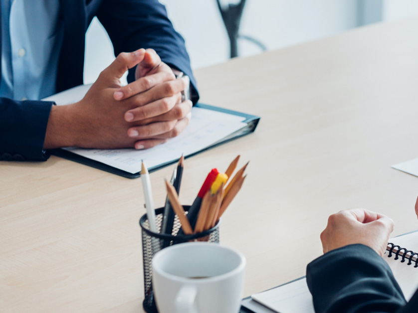 two people at desk for job interview