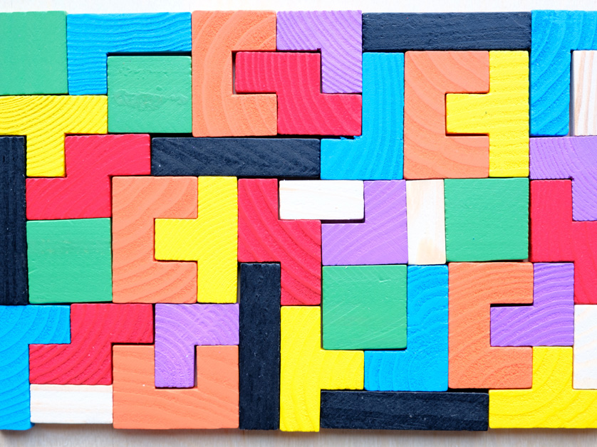 wooden tetris blocks on table