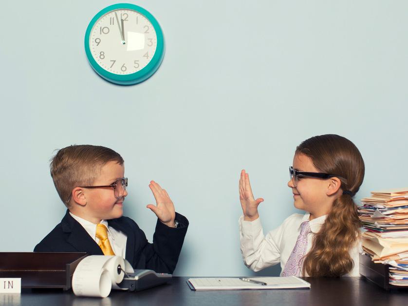 kids in business attire high fiving