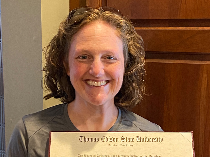 woman holding a diploma