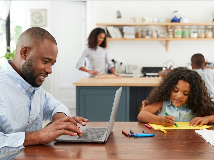 dad at kitchen table with daughter