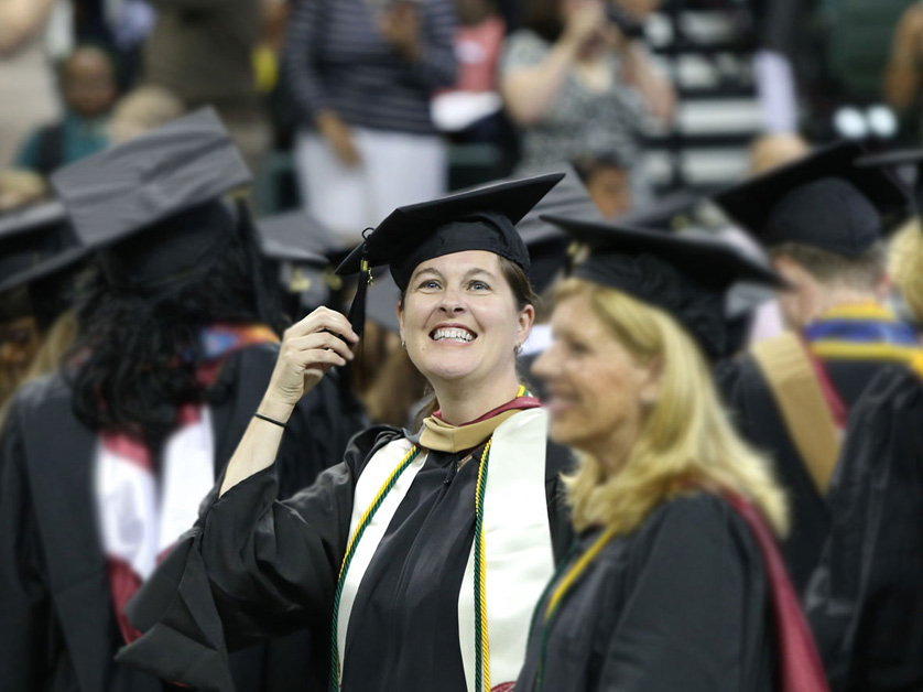graduate in audience smiling