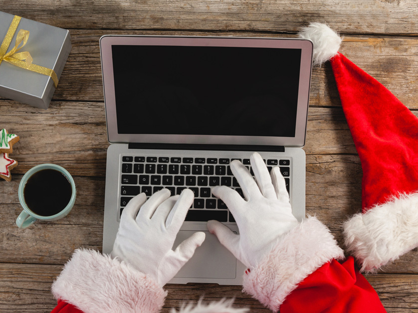 santa hands at laptop