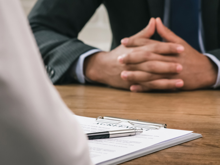 woman reviewing resume at a table