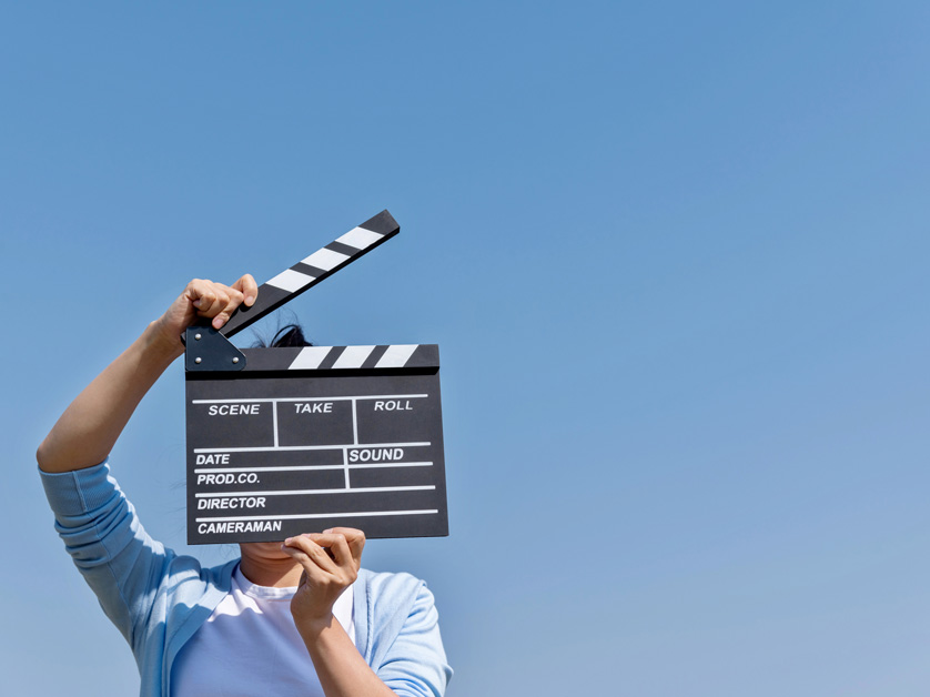 woman holding film slate