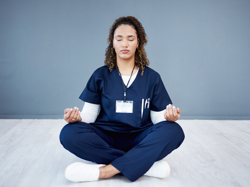 nurse meditating on floor