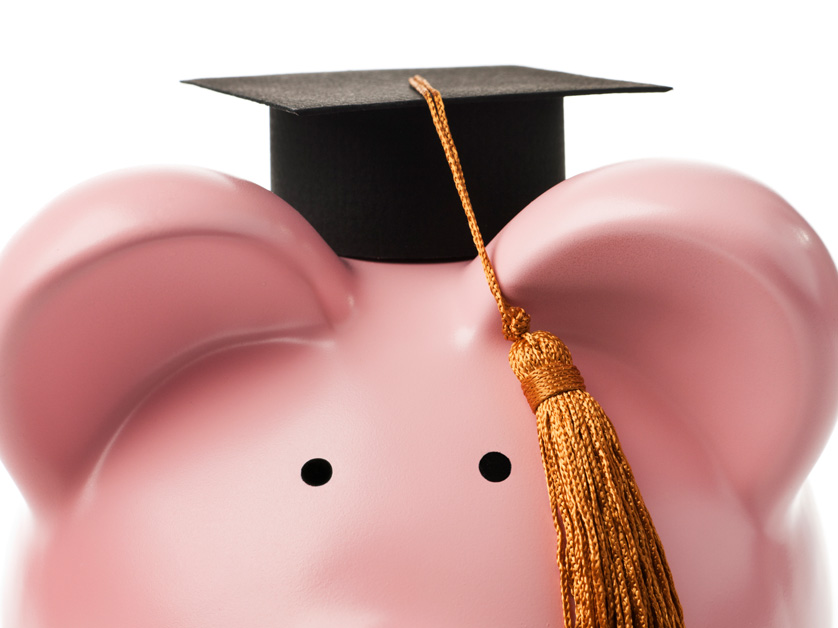 piggy bank with graduation cap on head