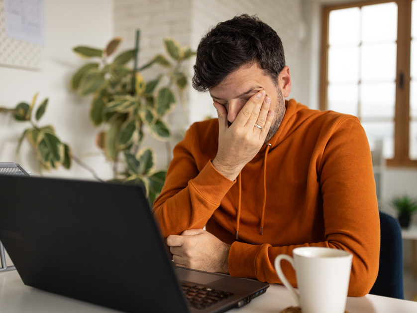 man in frustration at computer