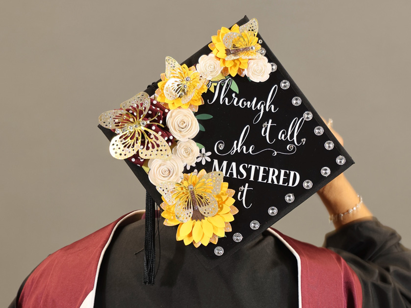 back of womans head wearing grad cap