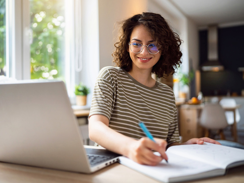 woman sitting at computer at home