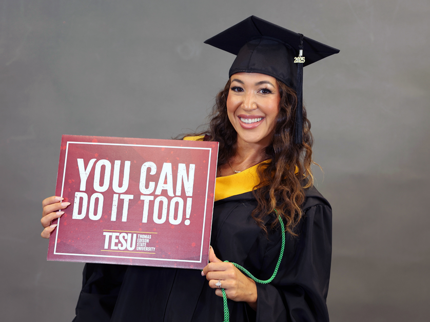 woman holding you can do it too at TESU sign