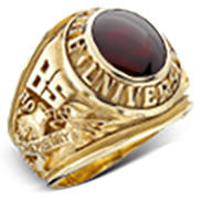 A product image of a gold school ring adorned with a red gemstone.