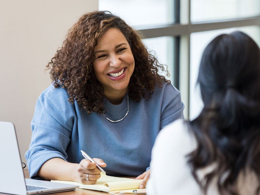 Thomas Edison State University student and an academic support staff person discussing a topic